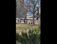 Woman black top spread arms sit barrier