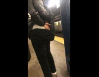 Woman pulls out wedgie and digs in pants at subway station