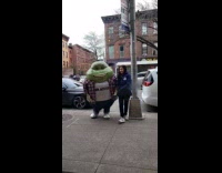 Mr mucus mascot walks on the street 