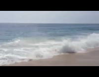 Man rides bodyboard crashes into waves