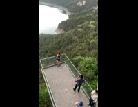 Collab IITW - Woman Wearing Blue Poses with Height View of Water and Trees 