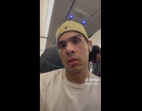 Guy scares off a kid on the plane 