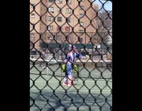 Guy wearing american flag onesie plays tennis 