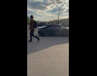 Girl inside convertible car filled with balloons