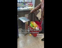 Woman shops at a grocery store in Sweden 