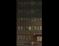 Windows of health center light up in pattern 