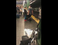 Collab WINY - man dances on two women platform