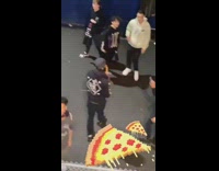 Man on boat party throws pizza to people