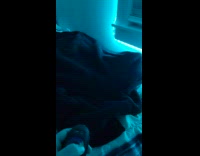 Guy shows checkered blanket with colored lighting 