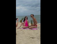 Girl pink swimsuit hold pineapple couple beach