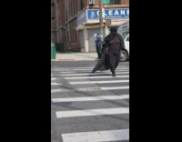 Person face covered long black clothing garments 