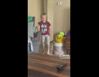 Sleepy little boy walks into living room 