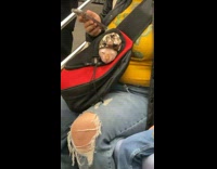Lady with orange cat in bag subway 