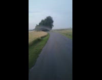 Arc shaped fog cross over the road