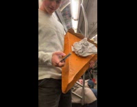 Man holds large slice of pie props