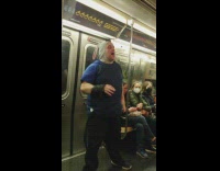 Man in Bunny Hood Sings in Subway Train