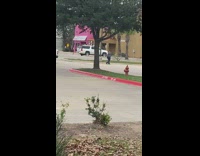 Man in black sweater karate practice at the parking lot