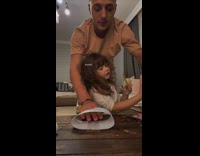 Man getting nails done plays with daughter