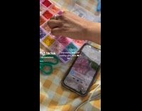 Ladies Hold Up Makeshift Bracelets and Beads Kit