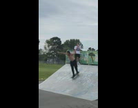 Guy rides skateboard down metal ramp fail 