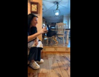 Dog carries underwear and plays with woman