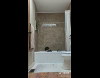 Guy cannonballs into white bathtub breaks it 