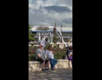 Guy blue shirt point dimples mask park