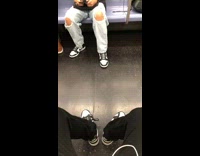 Three people wear same Nike shoes subway