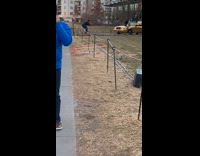 two guys laying on gold chrome car