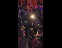 Woman hold selfie stick ring light bar