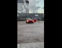 Man pictures red sports car part 1