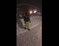 Guy jumps head first into snow pile 