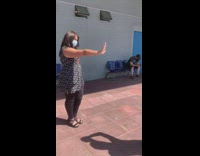 Woman in front of hospital for non-violence day
