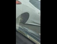 Tesla with missing tires 