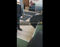 Guy gray cardigan paces back and forth talks about pages