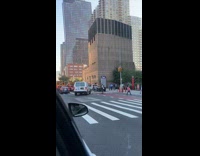 Couple rides electric skateboard on the street