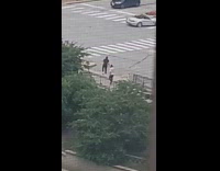 Man black shirt footwork dance sidewalk