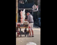 Man carves white statue on the street