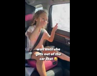 Young girl in car dance to music