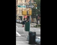 Red boots girl sits green box pole 
