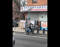 Elderly man using citibike as stationary bike 