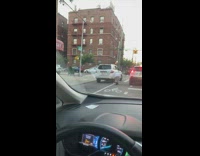 Guy throws baseball against wall in street