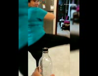 Woman kicks bottle out of guys hand