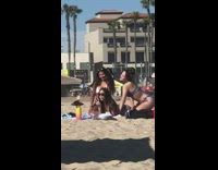 Three girls bikini tongue out peace sign