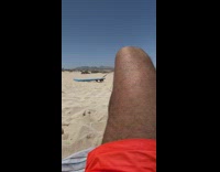 Collab Kook Of The Day - Girl drags blue surfboard beach sand windy