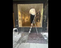 Collab WINY - Woman doing performance outside art gallery