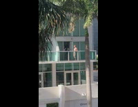 Shirtless girl remove hair tie dance balcony