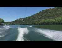 Guy riding black wakeboard jumps falls fail