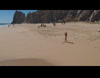 woman on beach attacked by drone