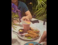 Waiter chooses credit card at random to determine who pays for meal 